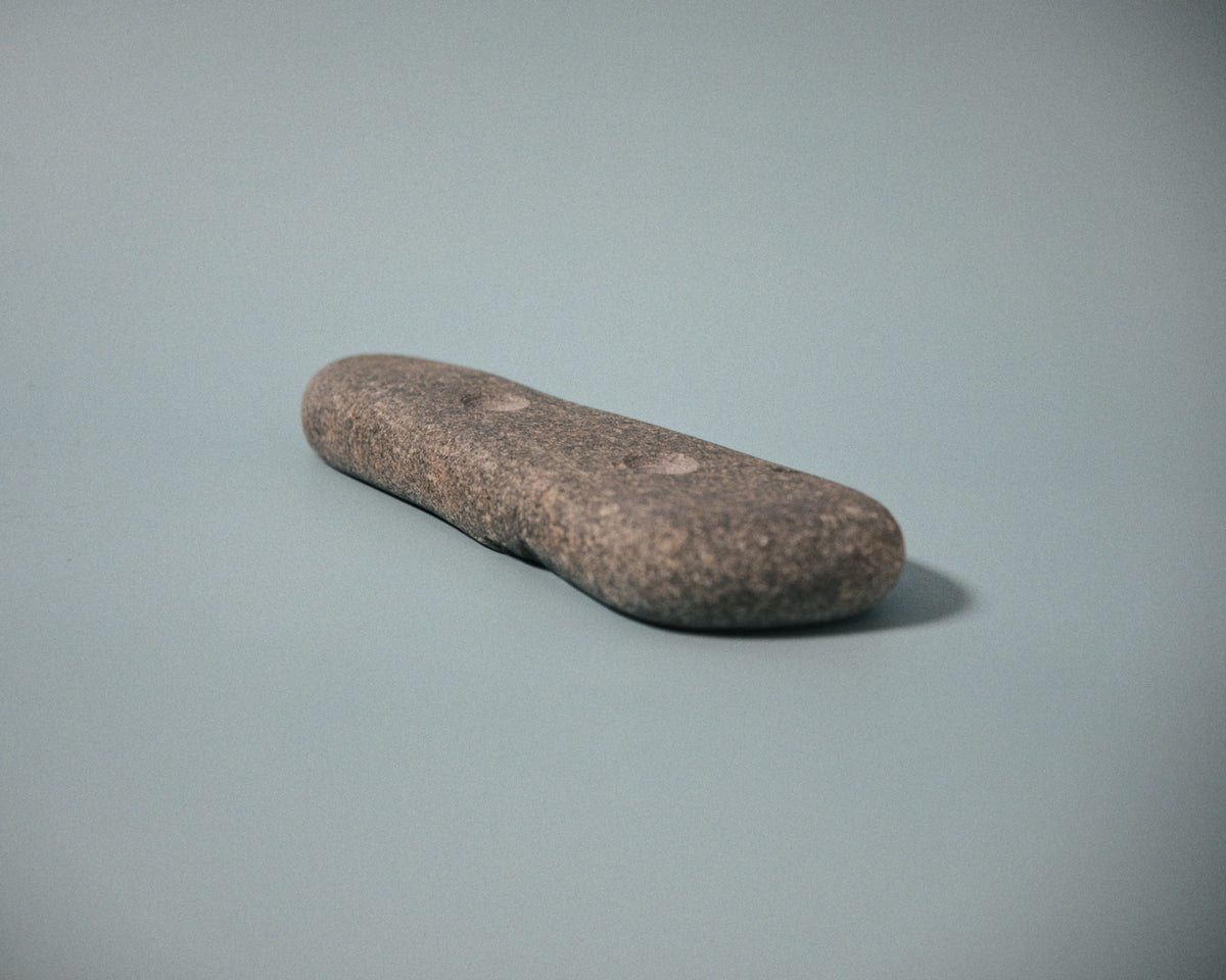 Medium pinch climbing hold made from a natural coastal stone (STO061)